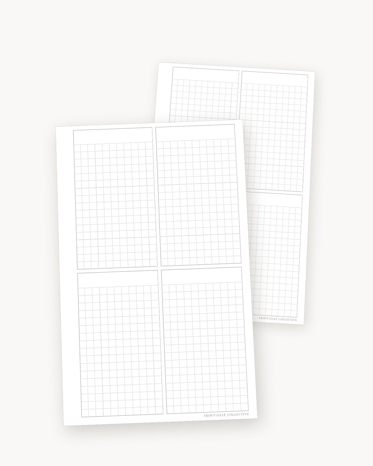 Four-Section Grid half letter planner inserts angled in a stack of two sheets