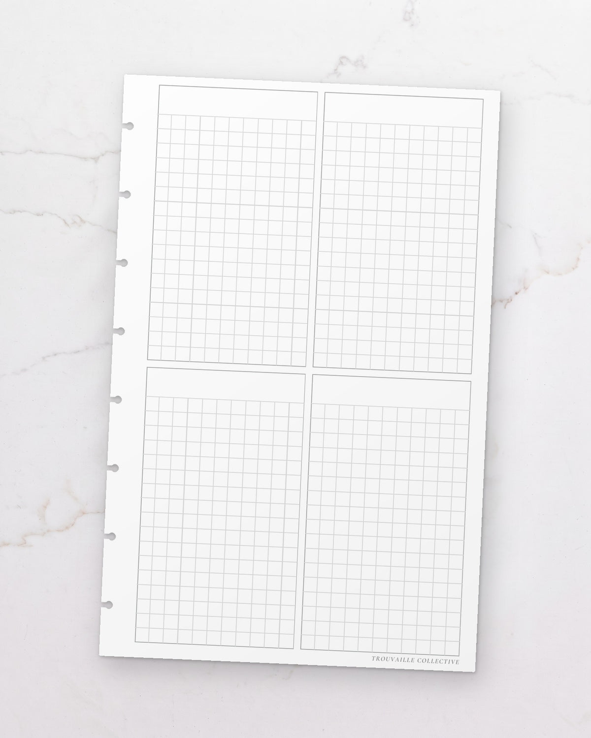 One Four-Section Grid half letter planner insert sheet, punched for 8-disc discbound planners