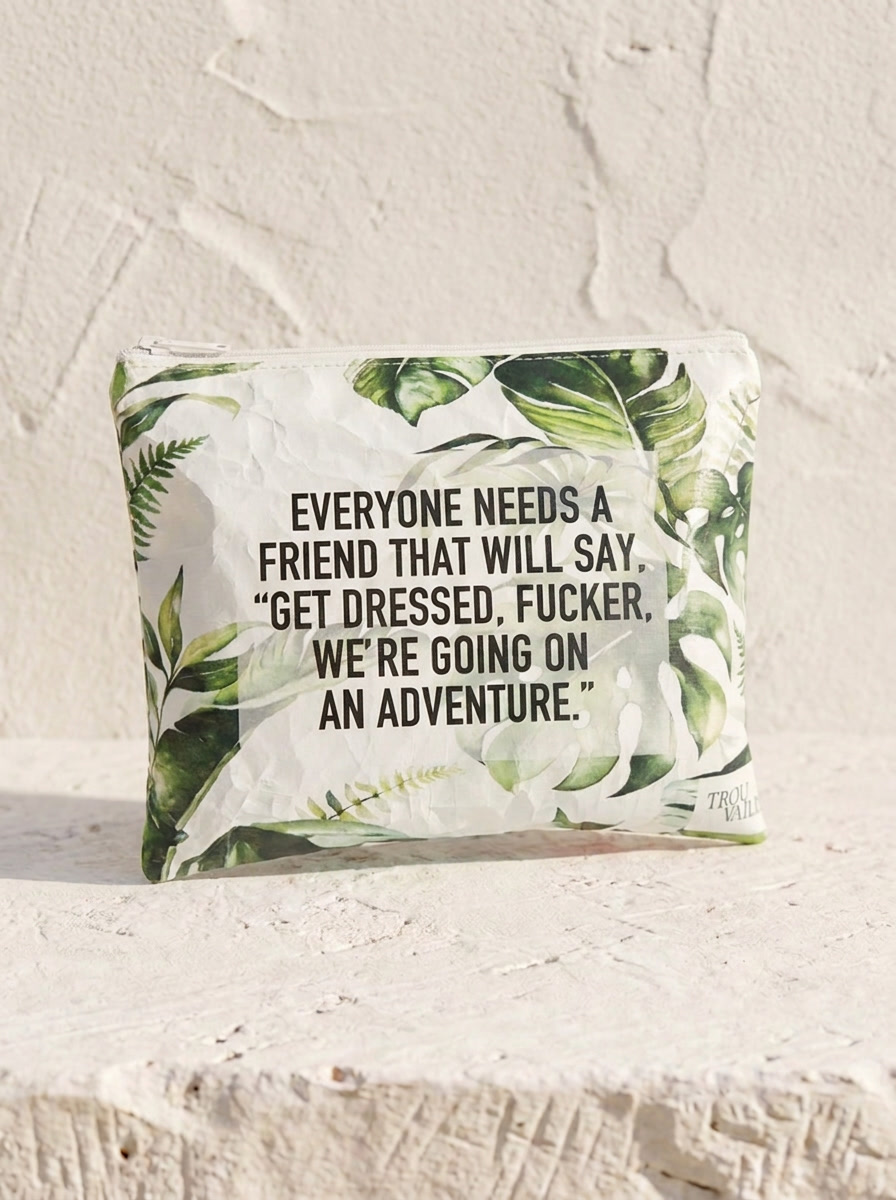 Get Dressed medium water-resistant accessory bag — a flat 12 x 9 inch travel pouch in a green botanical print with a hand-lettered adventure quote