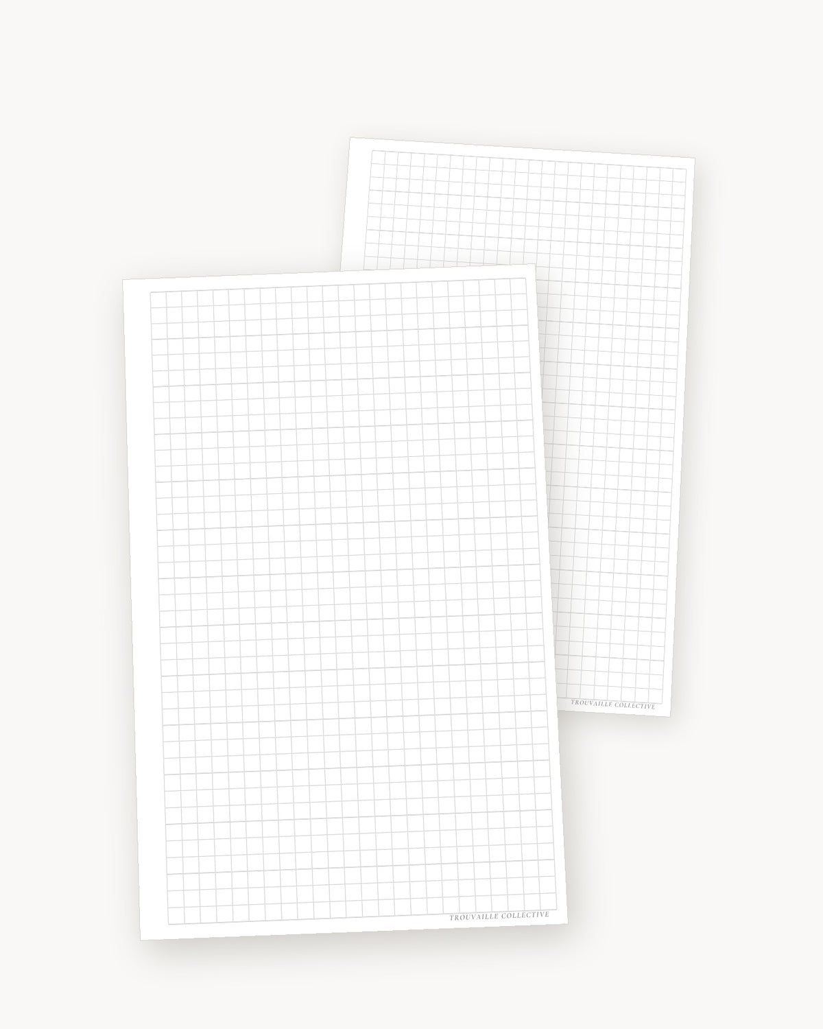 Grid half letter planner inserts angled in a stack of two sheets