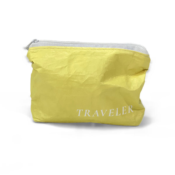 Lemon yellow Mini water-resistant accessory bag with white zipper and TRAVELER logo