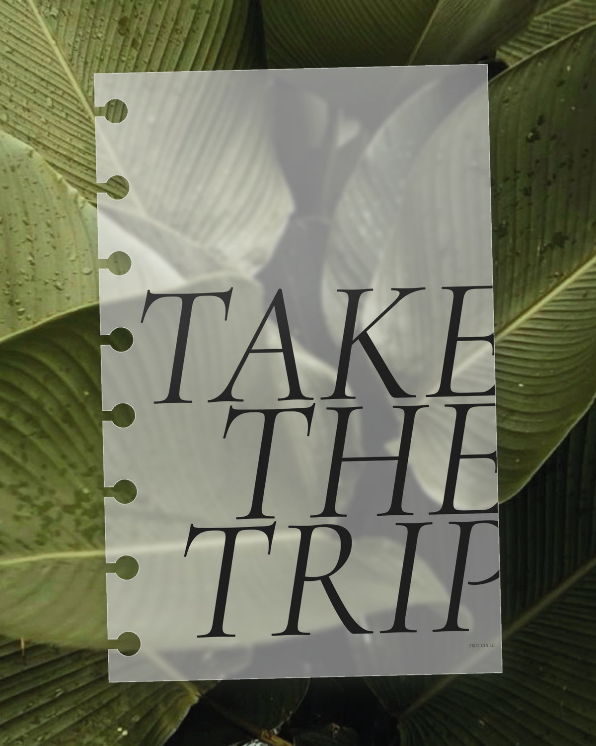 Take the Trip frosted planner dashboard on a green leaf, the leaf visible through the translucent plastic