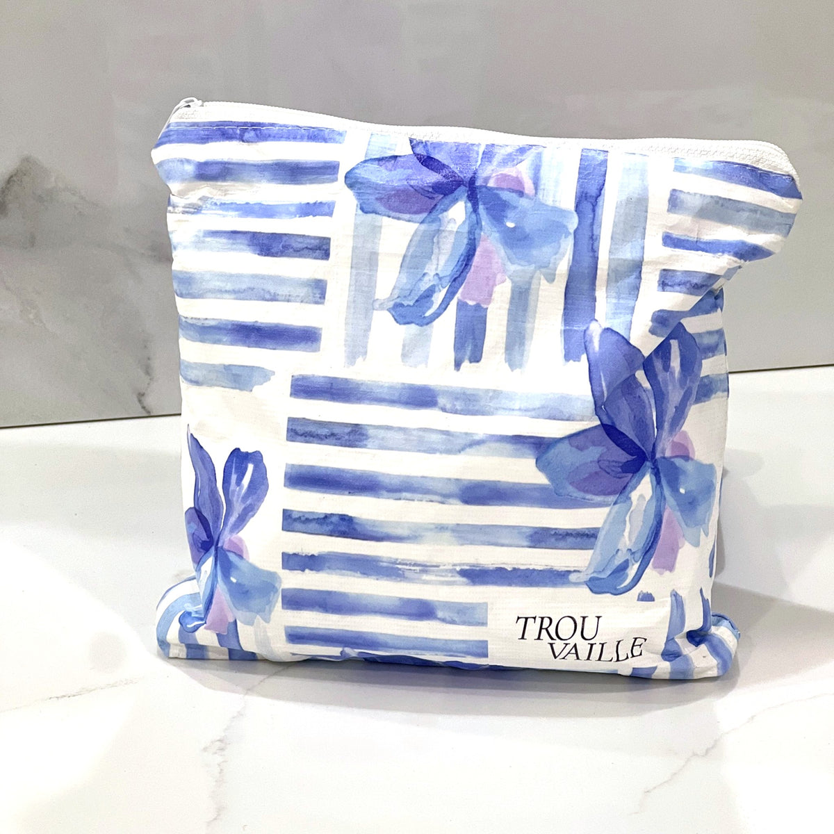 Blue Lines Small zip pouch on a white marble counter