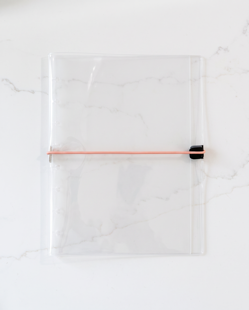 Clear half letter planner binder cover with thin coral elastic cord