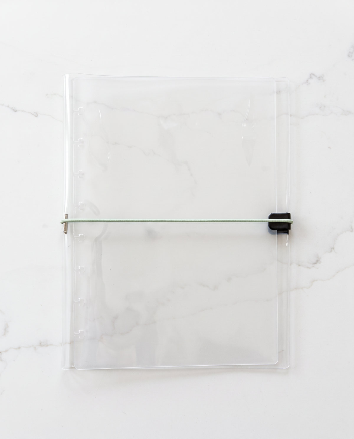 Clear half letter planner binder cover with thin sage green elastic cord
