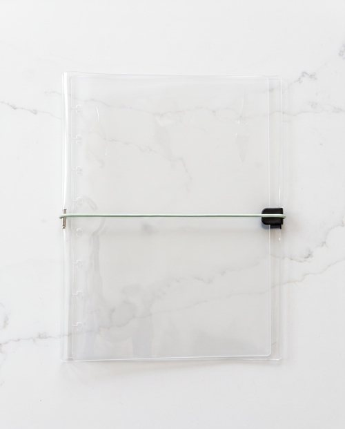 Clear half letter planner binder cover with thin sage green elastic cord