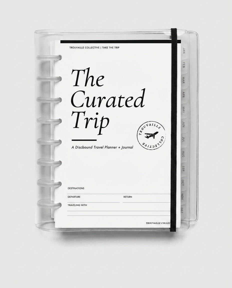 Discbound planner discs holding a half letter planner together under a clear cover