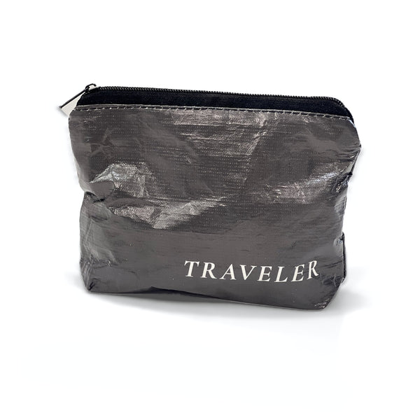 Ink charcoal Mini water-resistant accessory bag with black zipper and TRAVELER logo