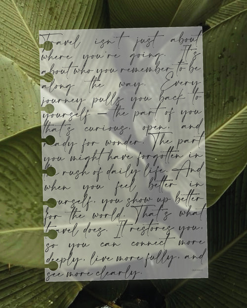Script frosted planner dashboard on a green leaf, the leaf visible through the translucent plastic