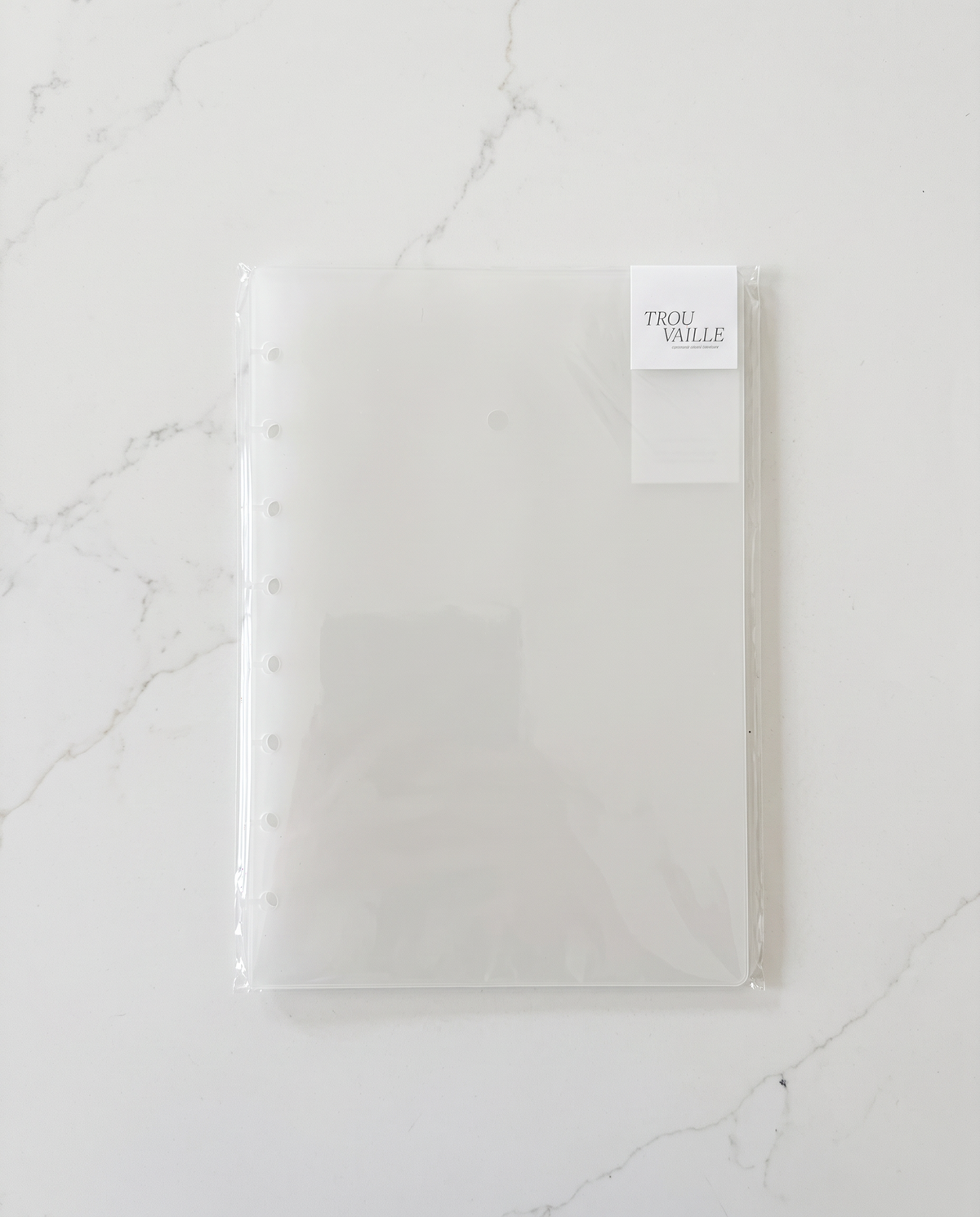 Clear frosted notebook cover set in its Trouvaille packaging