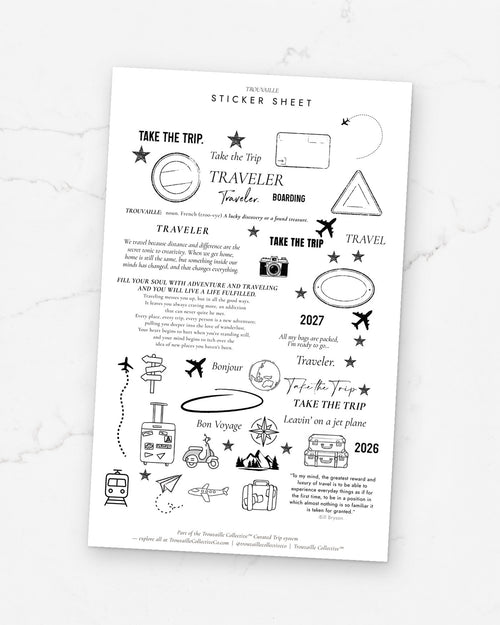 Travel Quotes clear sticker sheet on its backer card on white marble